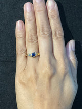 Duo Signet Ring with oval sapphire and diamond on hand