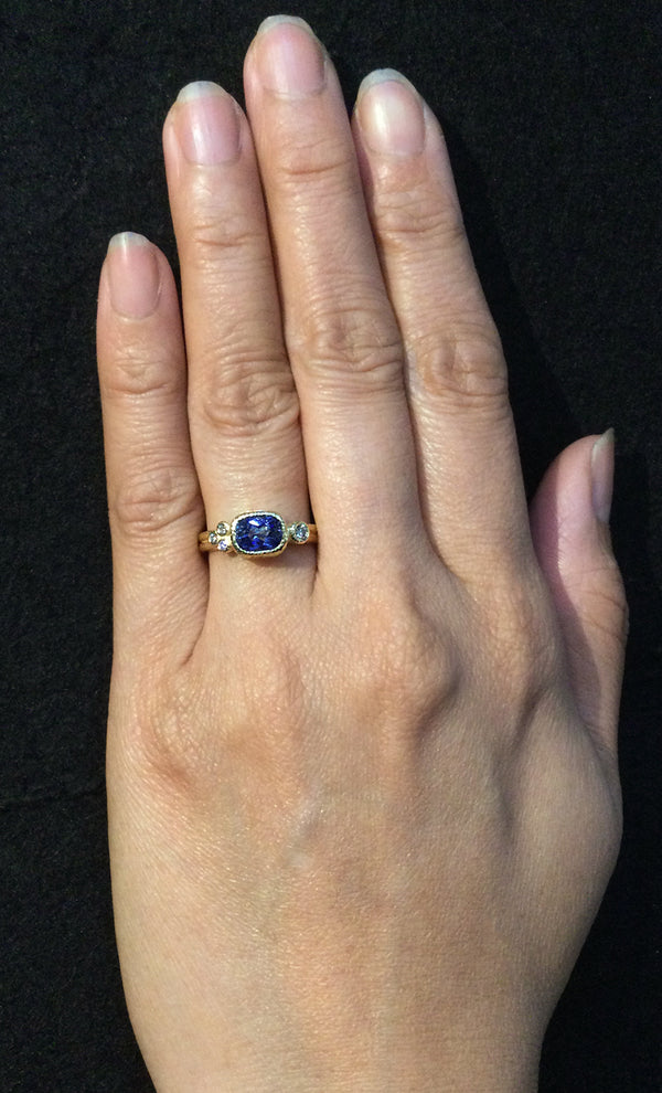 Delicate Double Band Cushion Cut Sapphire Ring with diamonds on hand