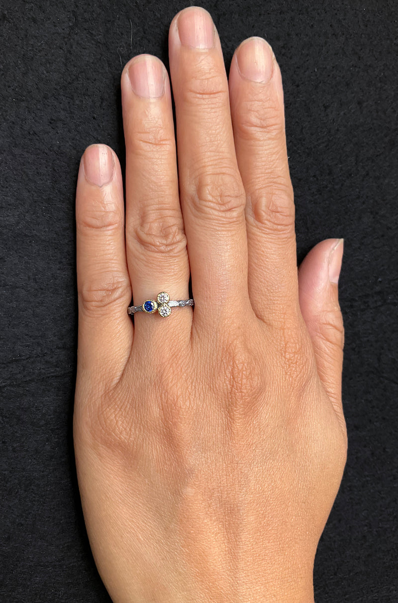 Skinny Pebbles Ring with sapphire and diamonds on hand
