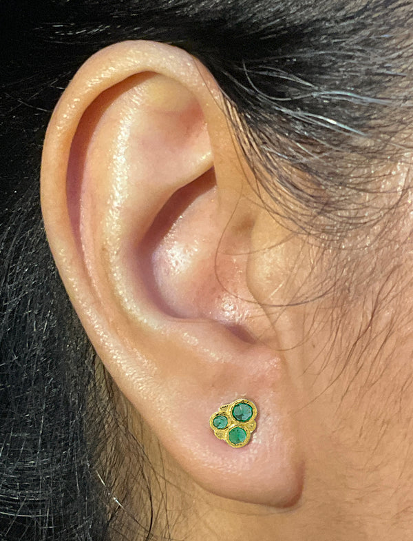 Emerald Cluster Stud Earrings on ear