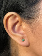 Emerald Pebble Stud Earrings in 18k yellow gold on ear