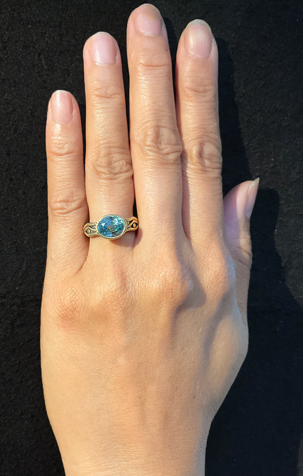 Wavy Watery ring with oval blue zircon