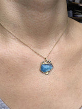 aquamarine pendant with salt and pepper diamonds on model