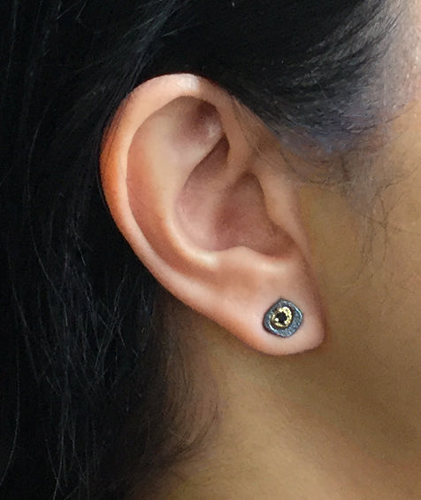 Black Diamond Pebble Stud Earrings on ear