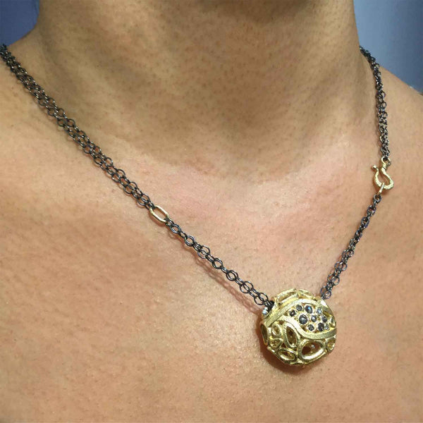 Confluence Pendant worn on neck