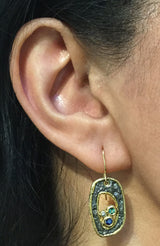Open Free Form Pebble Earrings on ear