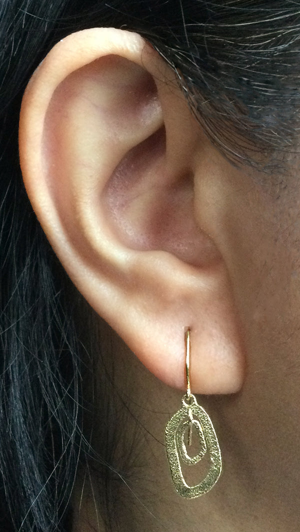 Free-form Dangle Pebble Earrings on ear