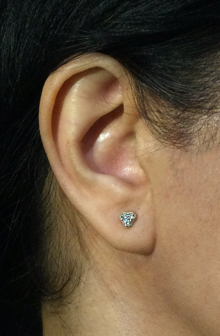 Dew Pond Three Diamond Stud Earrings on ear