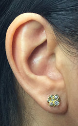 Diamond cluster stud earrings on ear