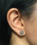 Diamond stud earrings on ear
