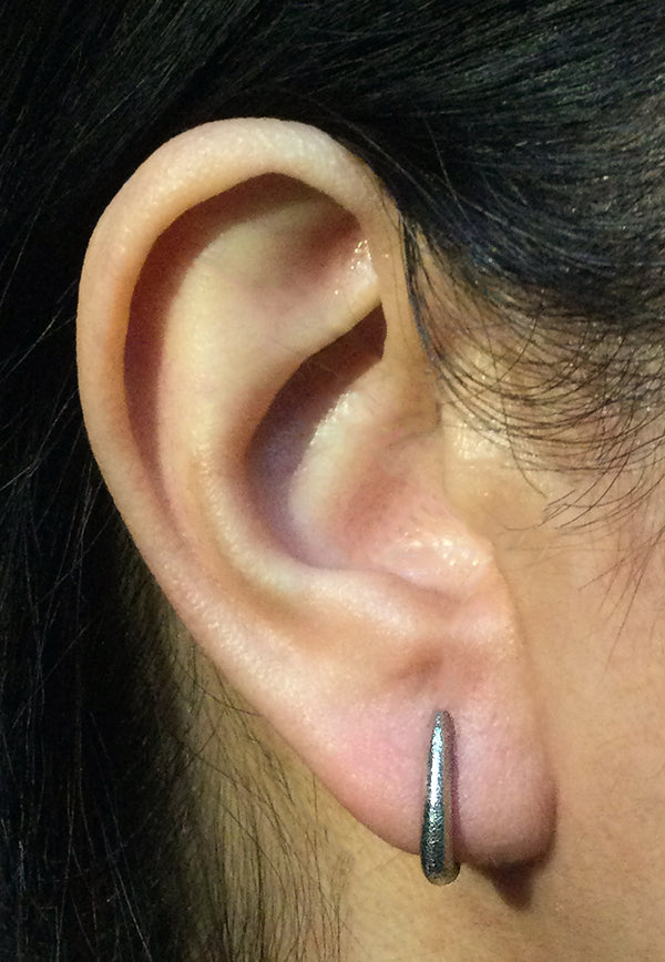 Elongated Ancient Hinged Hoop Earrings in 14k White Gold on ear