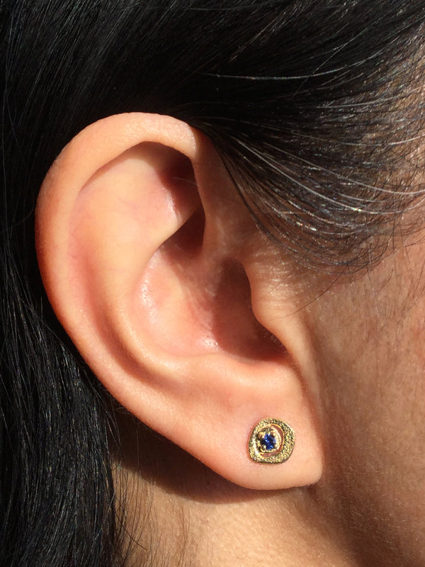Sapphire Pebble Stud Earrings in 18k yellow gold on ear