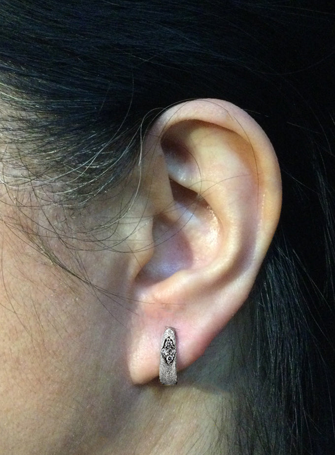 Ancient Hinged Hoop Diamond Earrings in 14k white gold on ear