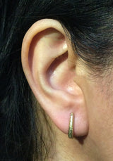 Elongated Ancient Hinged Hoop Earrings in 18k yellow gold on ear