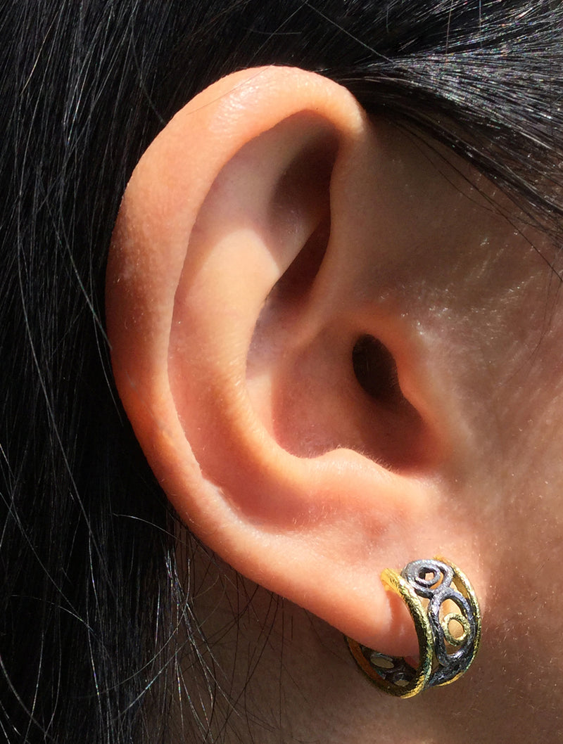 Open Pebble Small Hoop Earrings on ear