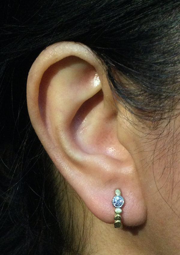 Skinny Pebbles Hinged Hoop Diamond Earrings on ear