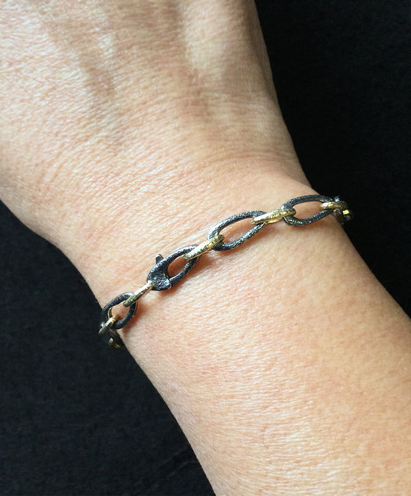 Organic small link bracelet on wrist