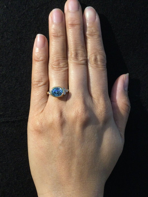 Skinny Pebbles Blue Oval Zircon Ring on hand